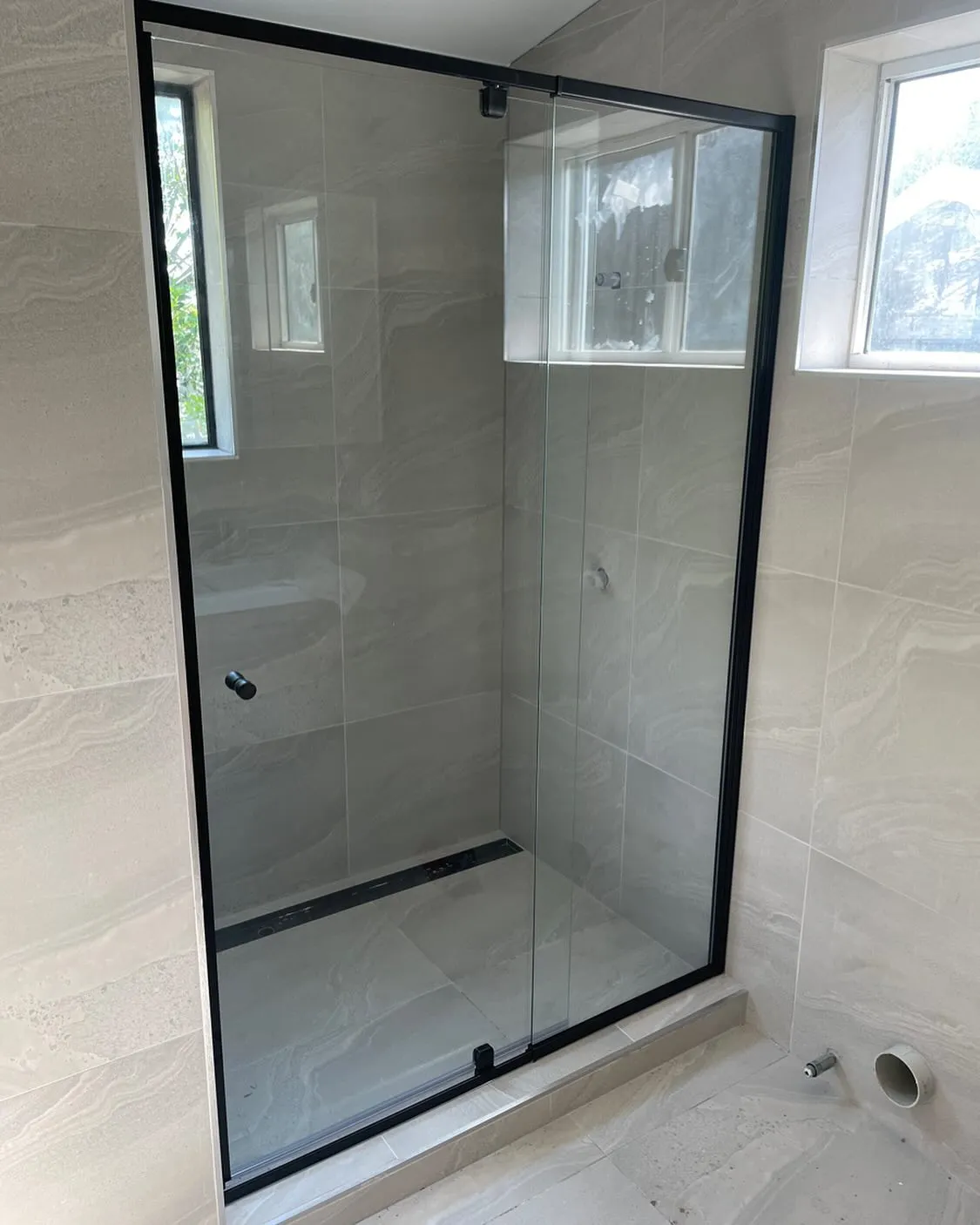 Black sliding shower screen over a bath — gallery shower black slider