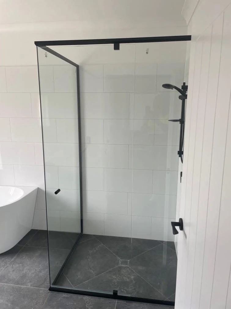 Wide black framed shower screen in a tiled bathroom — gallery shower black frame wide