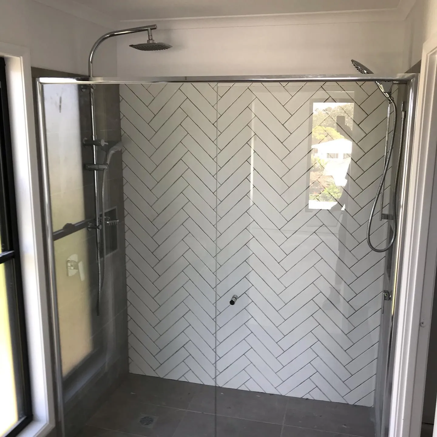 Shower screen against herringbone tiling — gallery shower herringbone tile