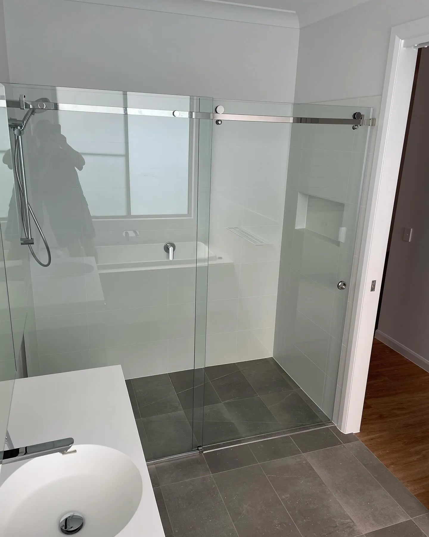 Chrome sliding shower screen next to a vanity — gallery shower chrome slider vanity